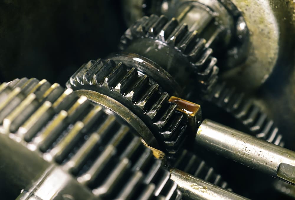 Gears of different sizes fit onto a shaft