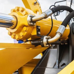 Hydraulic fluid hoses in application on yellow iron